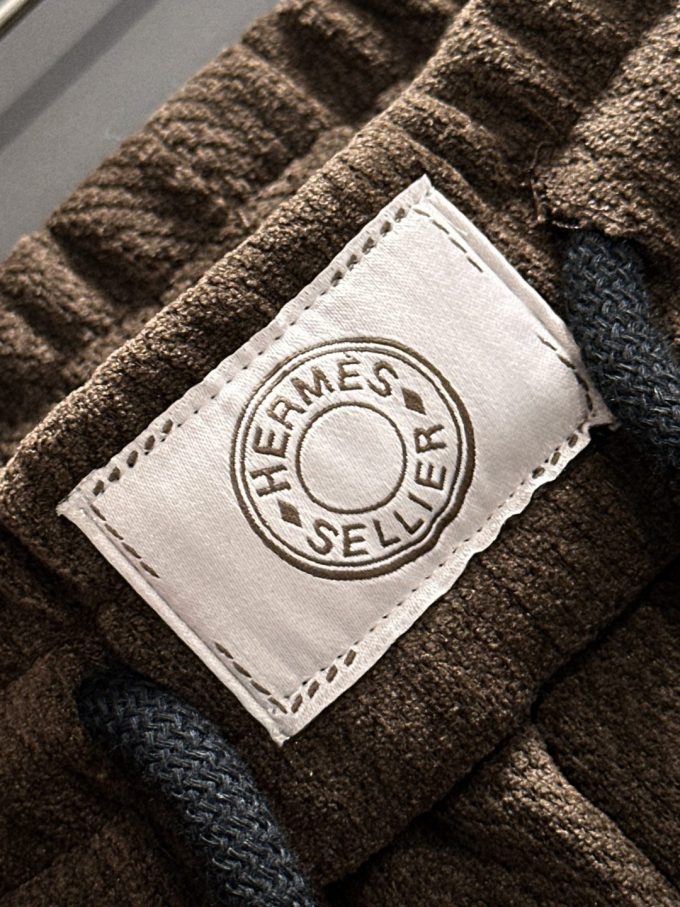 JC Hermes trousers are black and brown