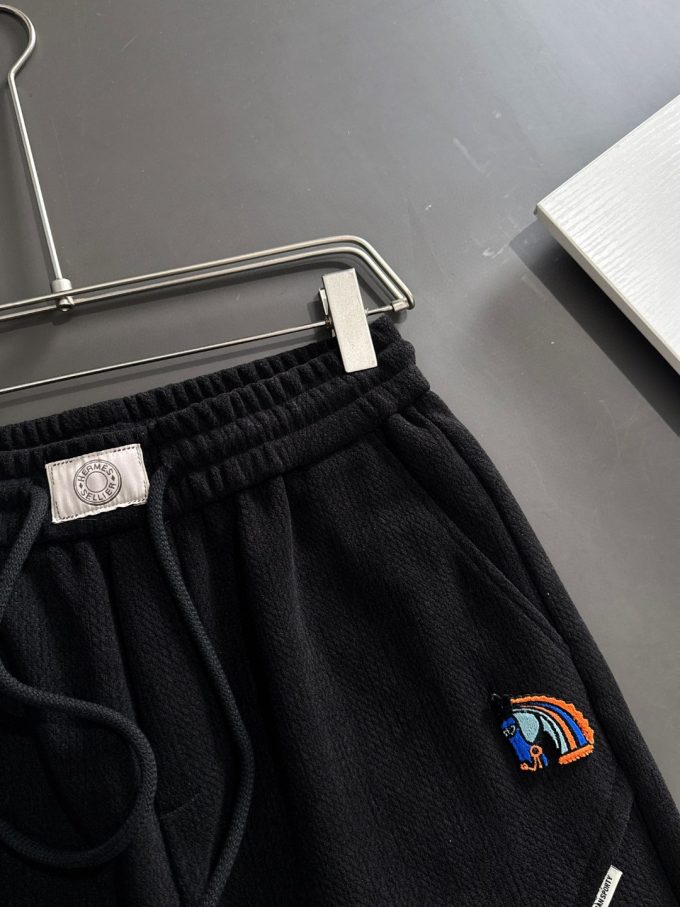 JC Hermes trousers are black and brown