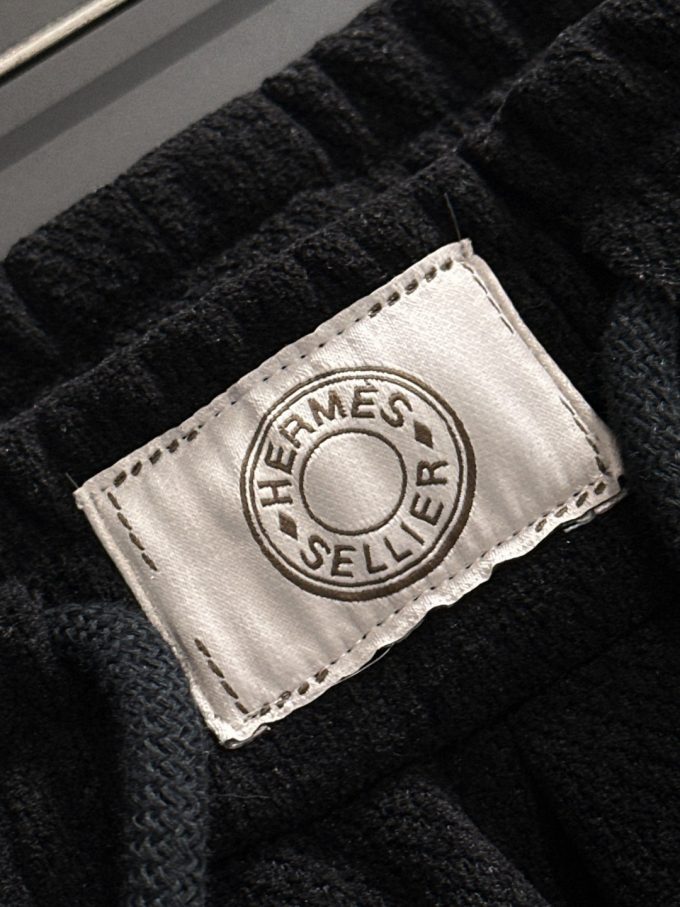 JC Hermes trousers are black and brown