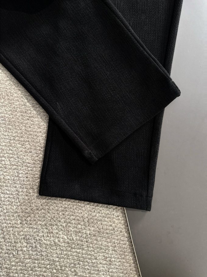 JC Hermes trousers are black and brown
