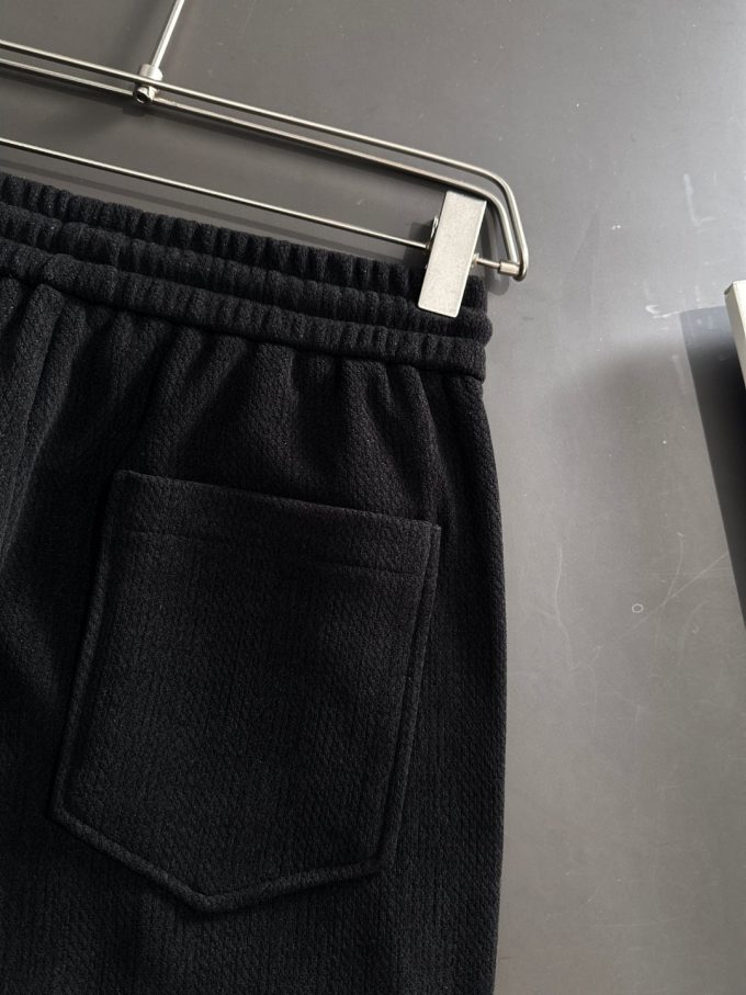 JC Hermes trousers are black and brown