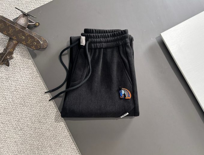JC Hermes trousers are black and brown
