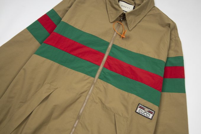 A Gucci red and green patchwork jacket on the chest