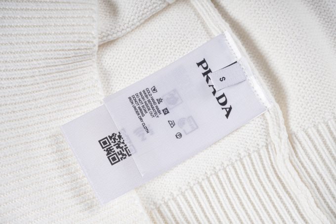 Prada's exclusive triangular logo design for a wool sweater