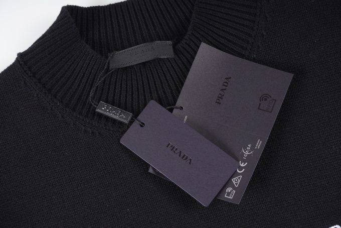 Prada's exclusive triangular logo design for a wool sweater