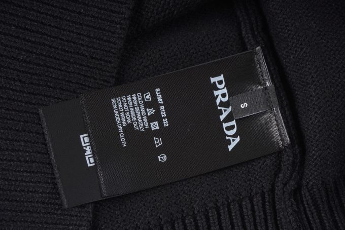 Prada's exclusive triangular logo design for a wool sweater